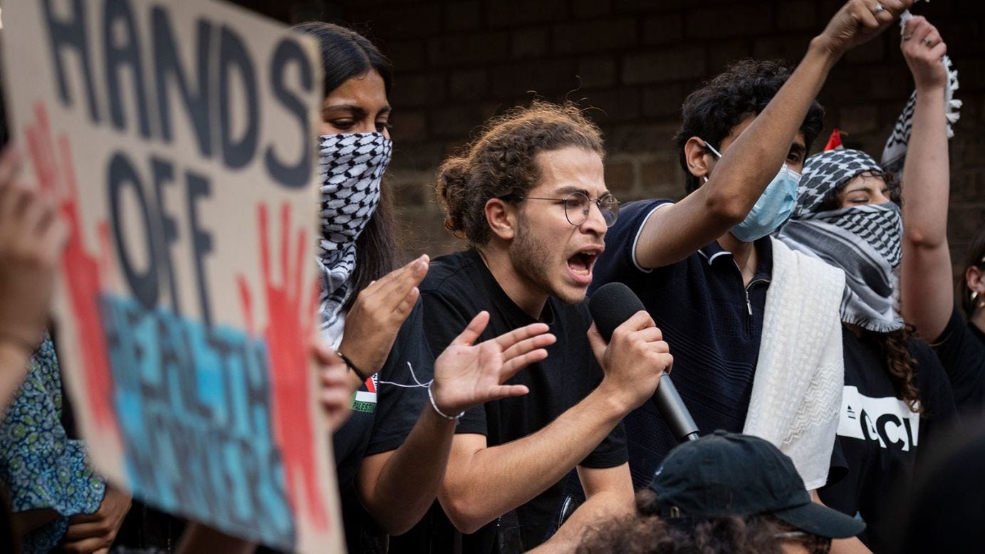 University student Usama Ghanem (center) faces deportation from Britain after King’s College London launched disciplinary action following his involvement in pro-Palestinian protests. University student Usama Ghanem (center) faces deportation from Britain after King’s College London launched disciplinary action following his involvement in pro-Palestinian protests.