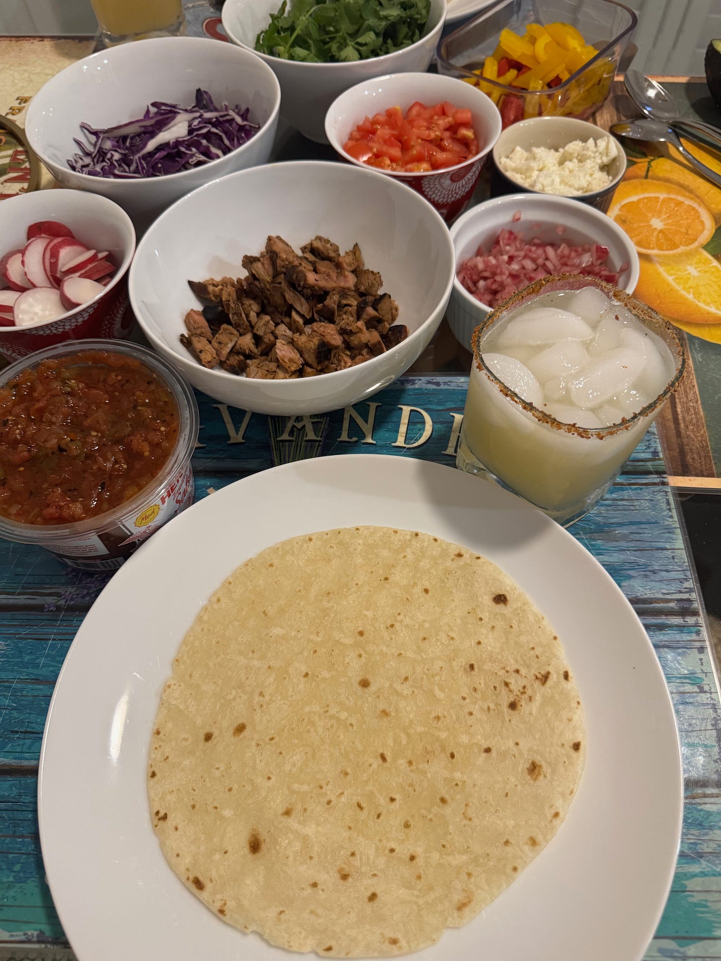 A California spring taco table spread with pork, pickled onion, red cabbage, cotija, salsa and tortillas — leftover pork taco recipe at The Dinner Bell Hearth A California spring taco table spread with pork, pickled onion, red cabbage, cotija, salsa and tortillas — leftover pork taco recipe at The Dinner Bell Hearth