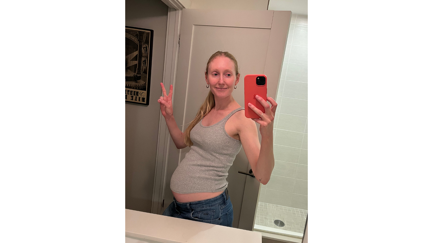 A bathroom selfie of pregnant Eliza