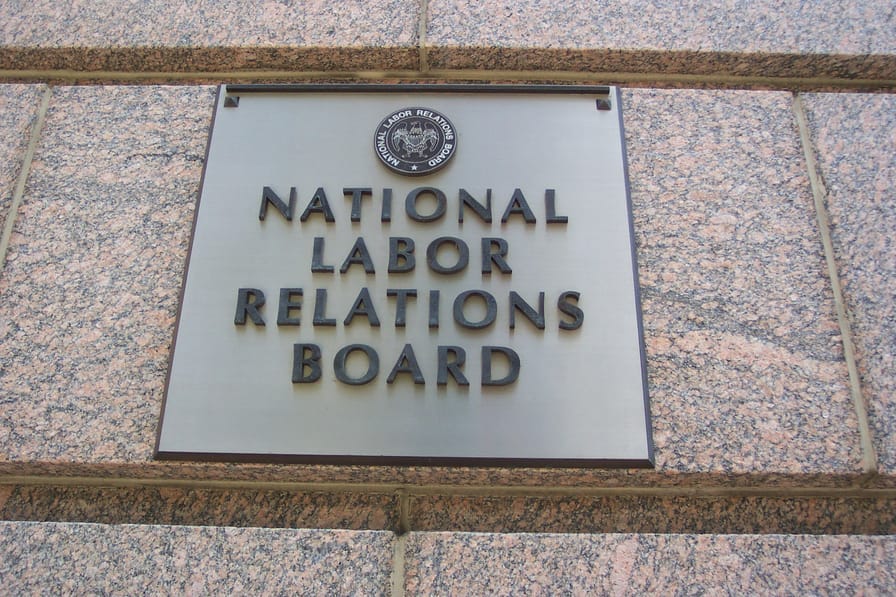 A sign on a building reads: National Labor Relations Board A sign on a building reads: National Labor Relations Board