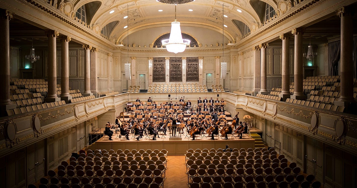 full orchestra at a dress rehersal full orchestra at a dress rehersal