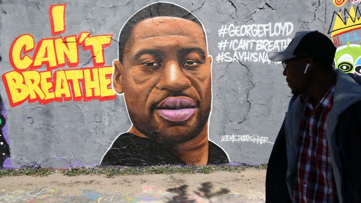 Street art commemorating George Floyd, killed in police custody in Minneapolis after footage emerged of him pleading for air as a police officer kneeled on his neck, is seen on May 30, 2020 in Berlin, Germany. One of the four officers involved was arrested and charged with murder after three days of protests. Floyd’s death marked protests around the world.