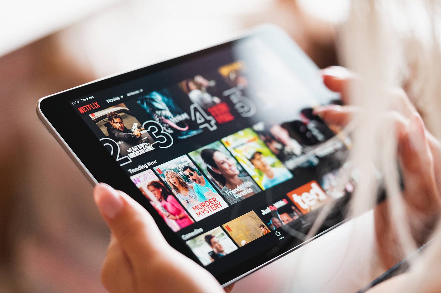 Woman Browsing Netflix App with Movies on Her Tablet | Free Technology  Image by picjumbo