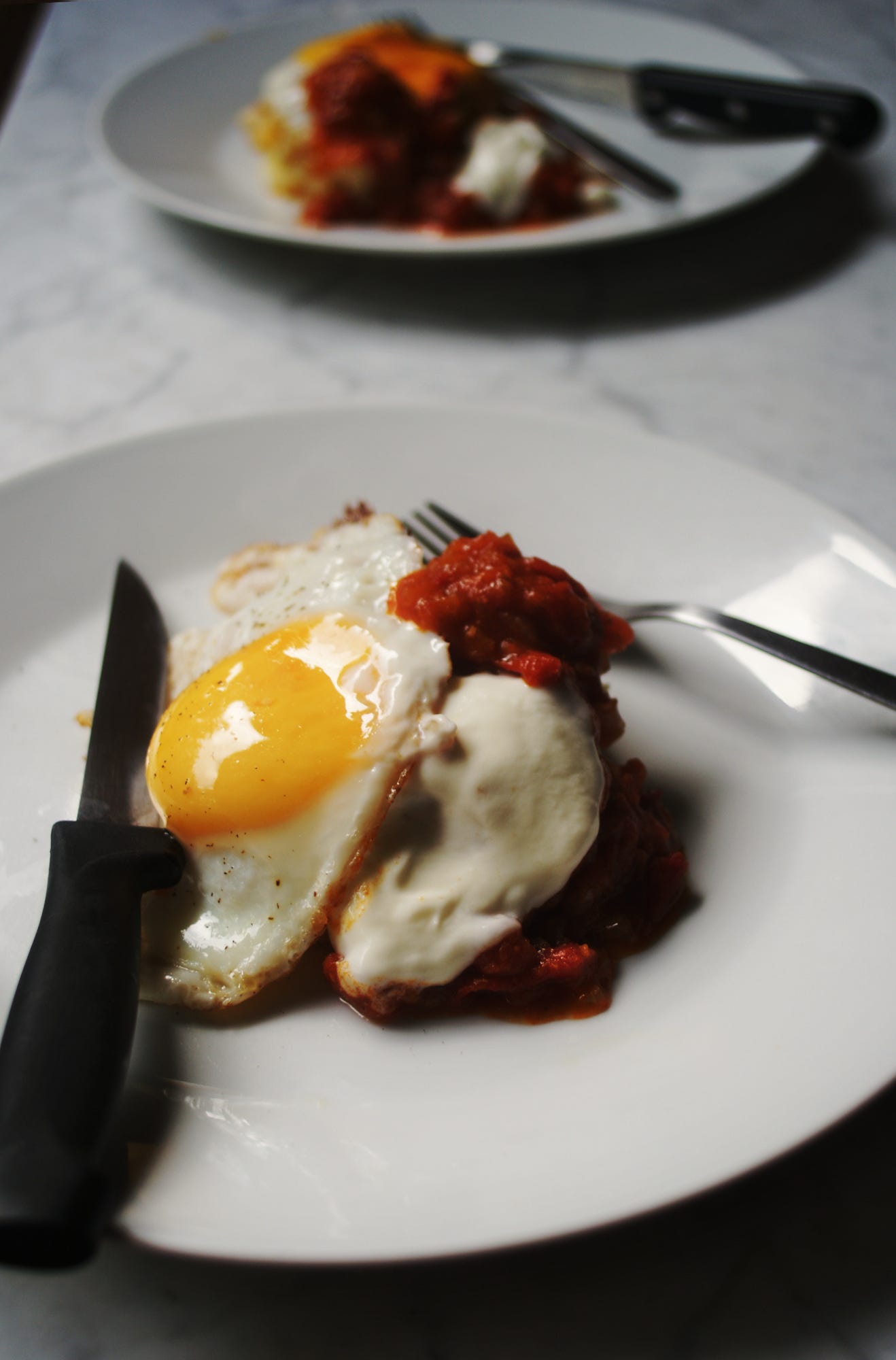 Mashed potato cakes and fried eggs