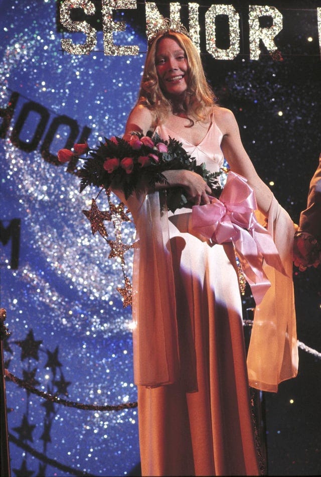 r/whatthefrockk - Sissy Spacek in Carrie 1976. The pink satin prom dress by costume designer Rosanna Norton was originally red in Stephen King’s novel, but was changed to be baby pink to better suit the character and create a more dramatic visual contrast for the flim’s bloody climax of being drenched in pig’s blood.