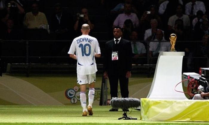 Zinedine Zidane walked past the World Cup trophy as he left the pitch ...
