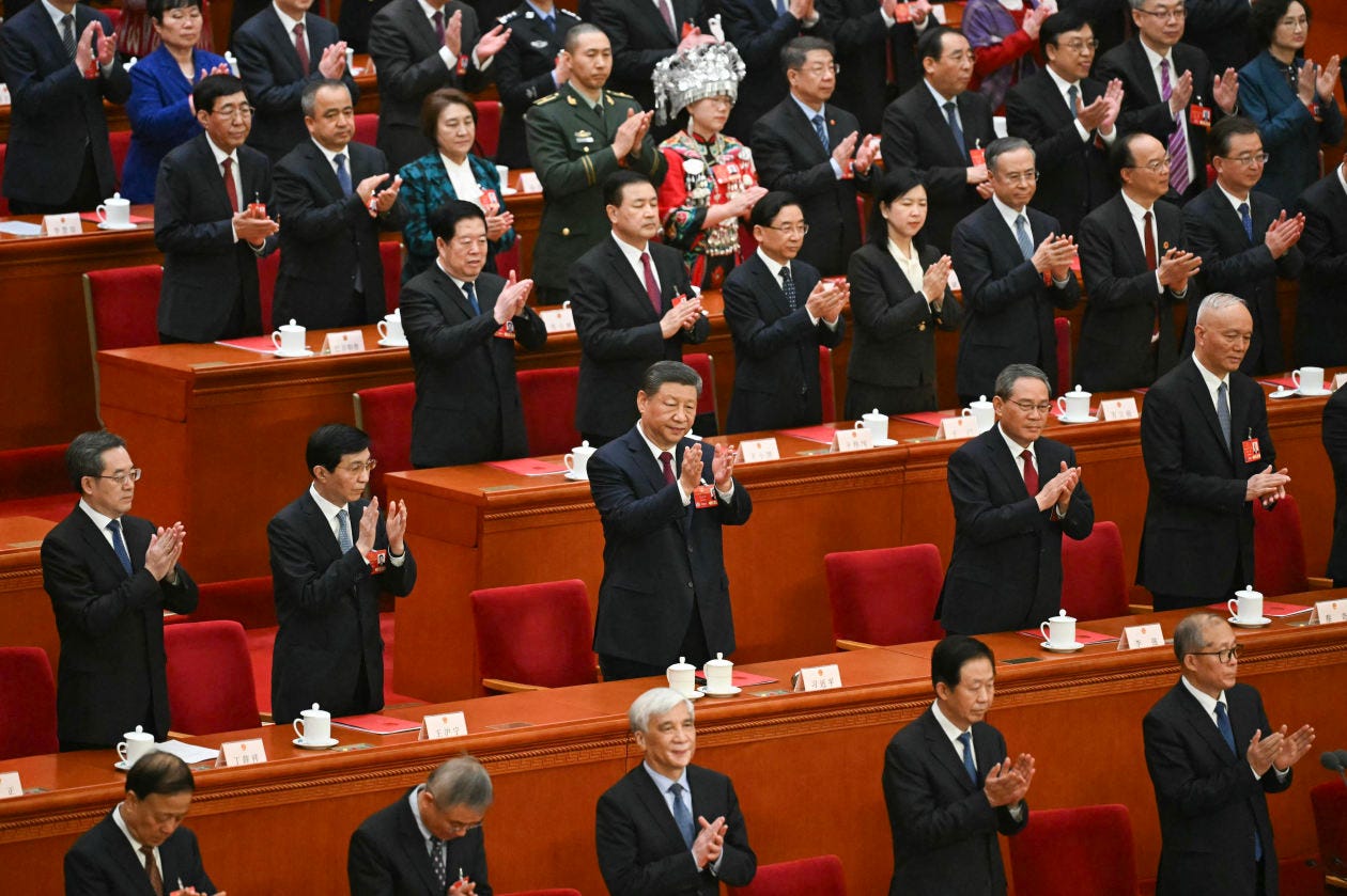 Chinese President Xi Jinping applauding at the end of the National People's Congress.