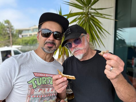 people outside having a party, playing live music and a swimming pool and bbq