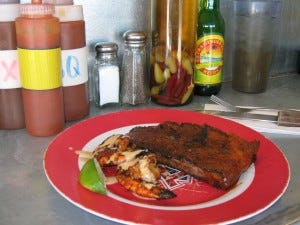 Grill-master Eddie Jimenez offered a shrimp-rib sampler to us misguided types.
