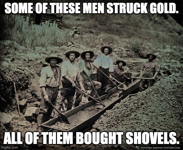 Gold rush miners holding shovels, illustrating the picks-and-shovels investing lesson and why AI infrastructure suppliers like Celestica benefit regardless of whether GPUs or TPUs win.