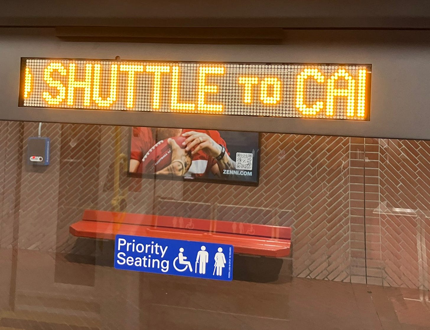 A sign in a bus stop

AI-generated content may be incorrect.