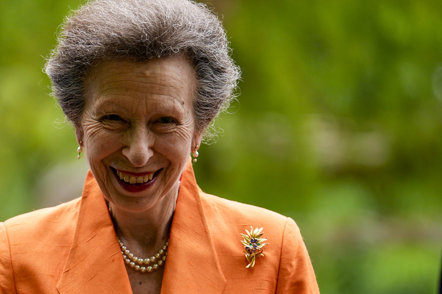 Princess Anne wearing orange