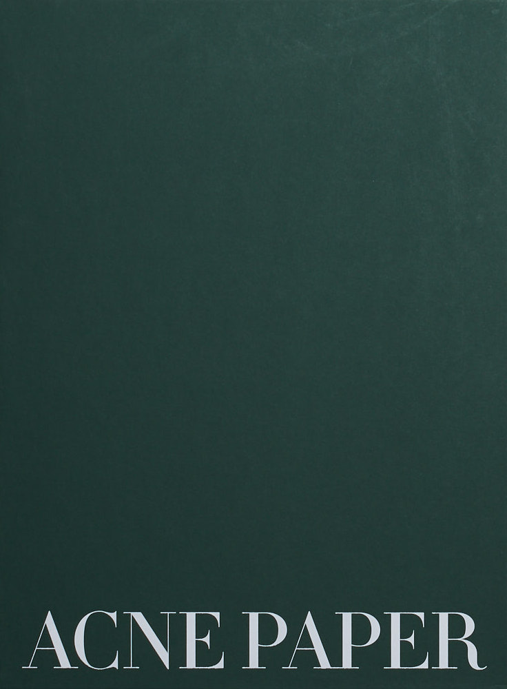 A plain bottle green background with the title "ACNE PAPER" in an elegant white serifed font near the bottom.