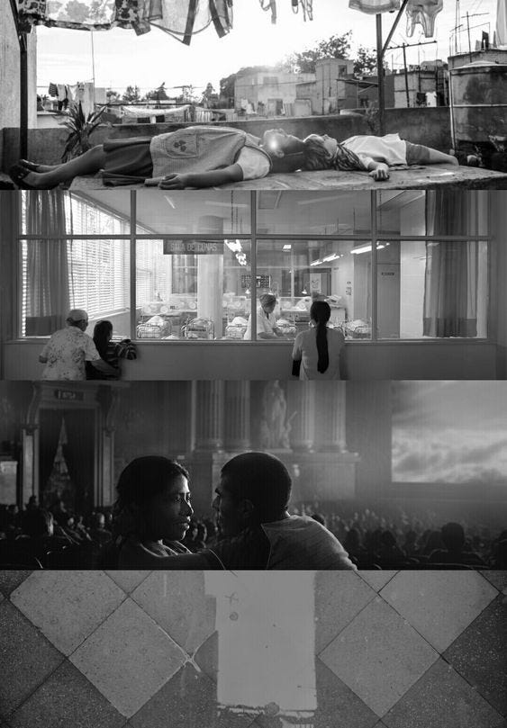 This may contain: black and white photograph of people in a room