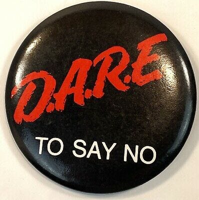 Image result from https://www.ebay.com/itm/DARE-To-Say-No-To-Drugs-Drug-Abuse-Resistance-Education-3-5-Pinback-Nice-/363095098063