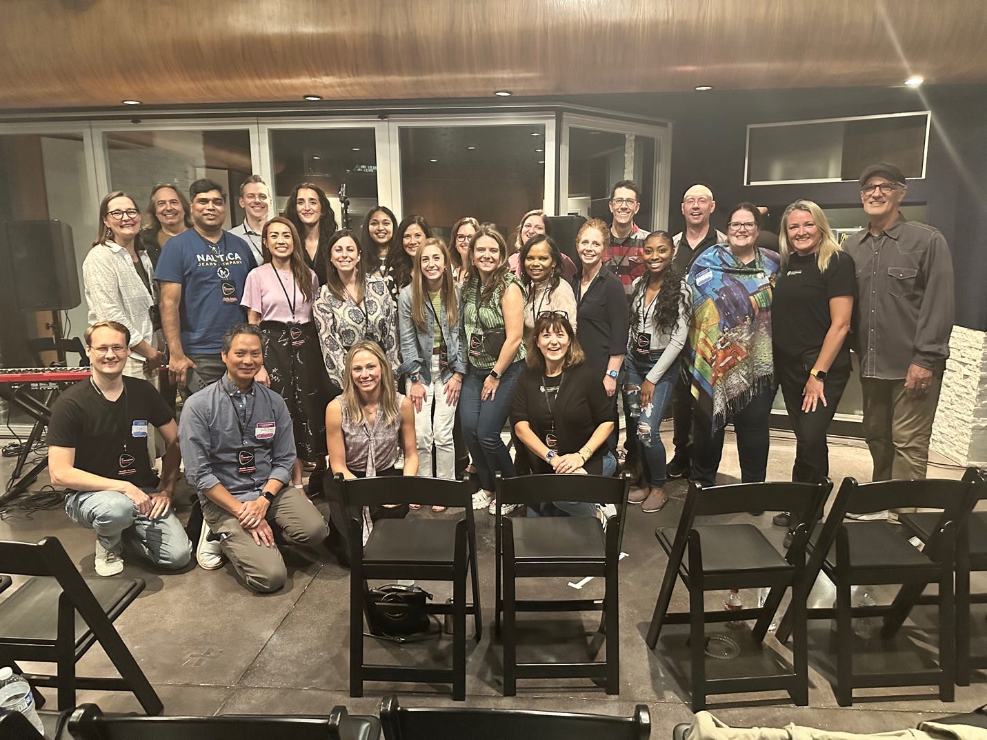 A group of people posing for a photo

Description automatically generated