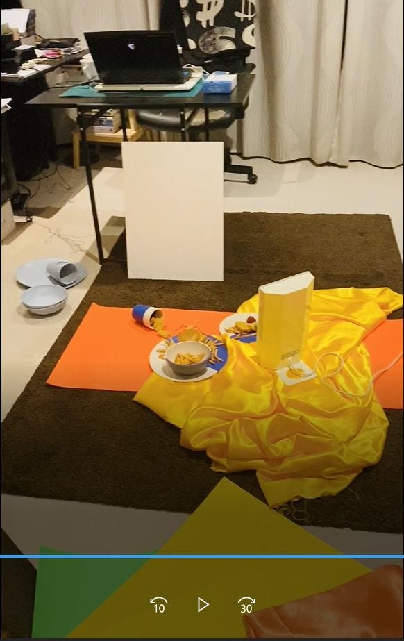 Kitchen mess and mess on floor with bamboo plates and food items. Product photoshoot in progress.