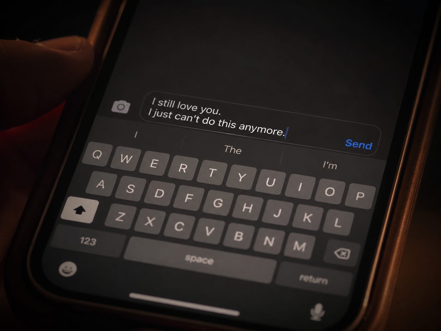 A phone screen showing an unsent message in a chat box, symbolizing unspoken thoughts and emotions.