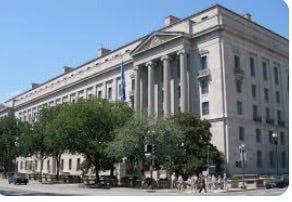 DOJ building - Frank Report Silenced By Design: Trump’s DOJ must decide whether due process still matters in Washington - the immunity question in the Frank Rose case.