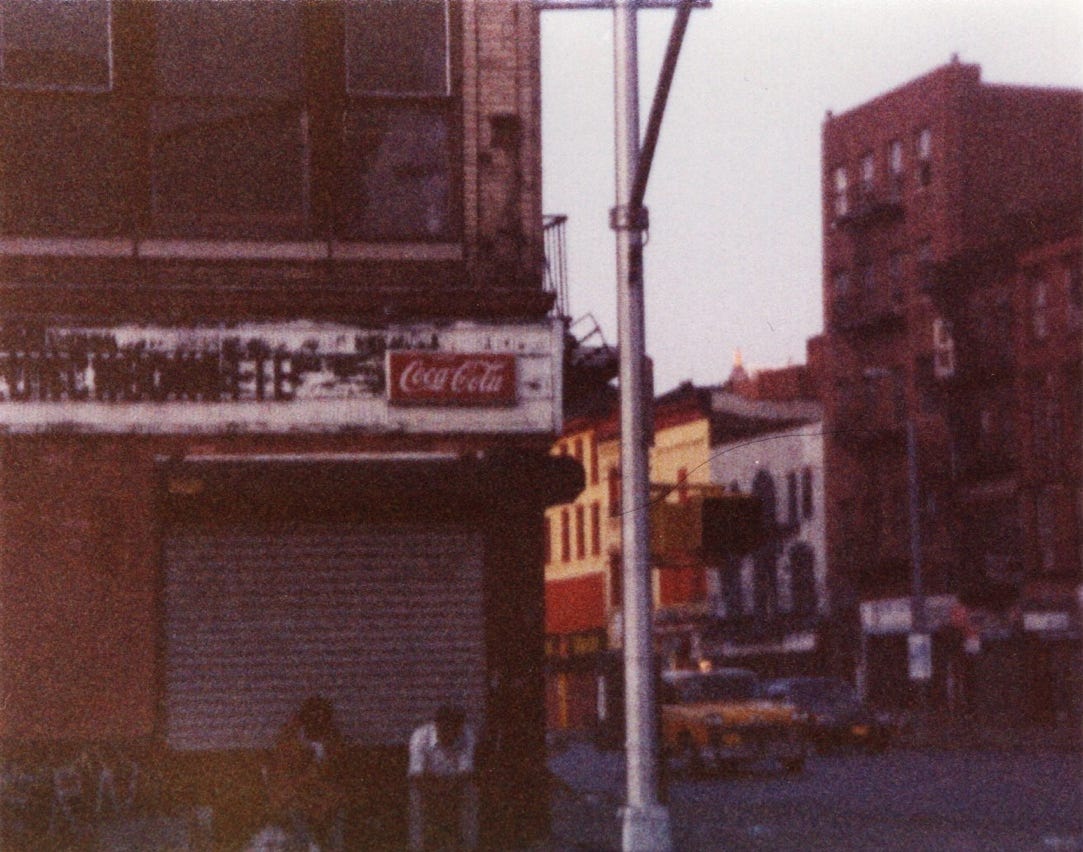 A building with a coca cola sign

Description automatically generated