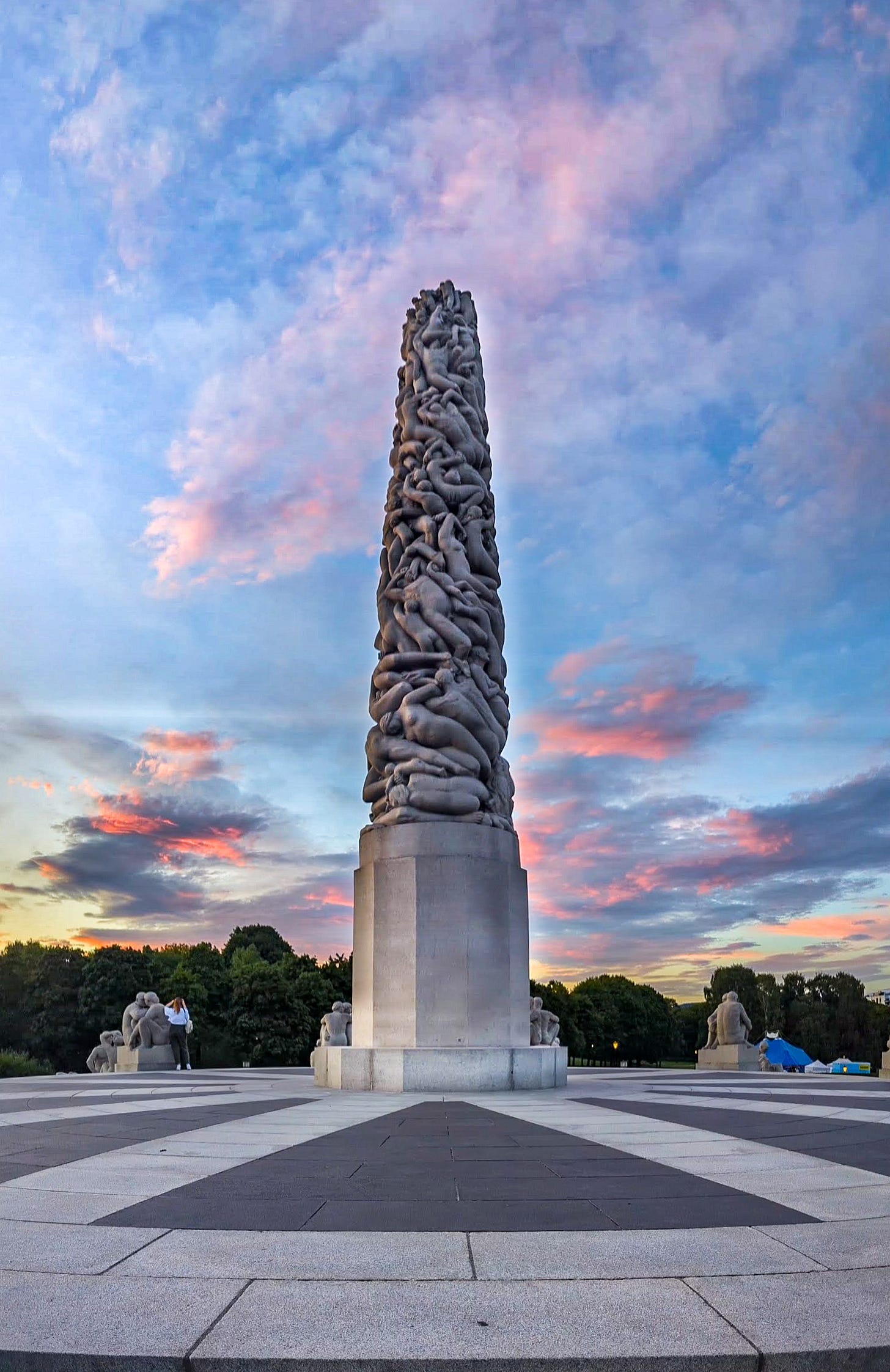 The Monolith with a colorful sunset behind it. 