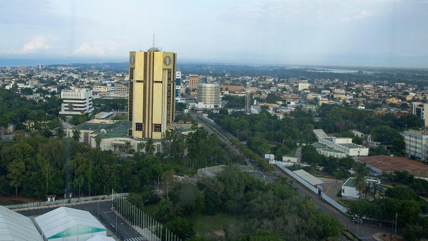 A city view of Lome, showing one tall building at the centre towering over other smaller buildings stretching to the horizon