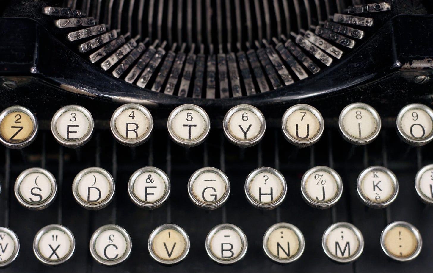 Manual typewriter with white and silver keys