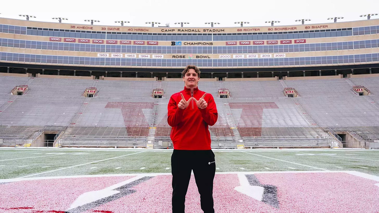 Wisconsin Badgers quarterback Colton Joseph stands on the field inside Camp Randall Stadium. 