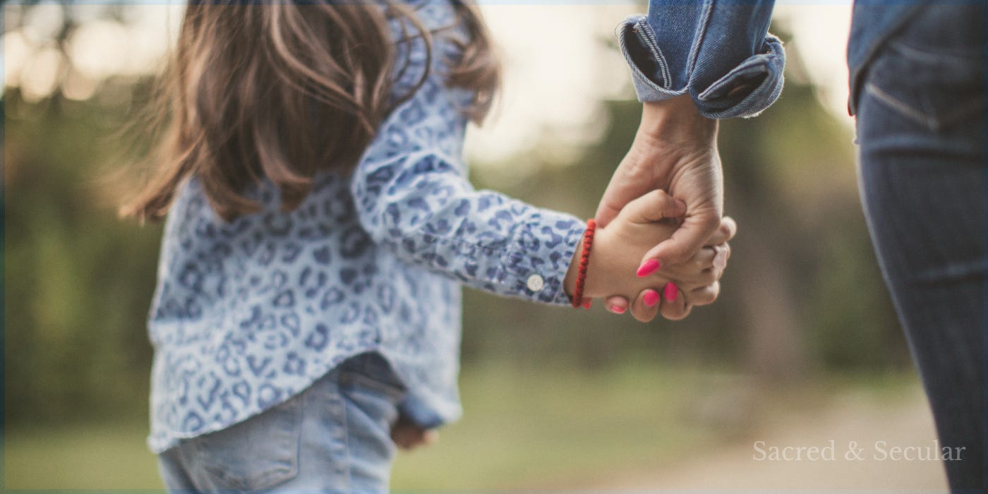 A young child walks hand in hand with an adult along a path, photographed from behind, symbolising trust, guidance, and taking the next step together into an uncertain future. A young child walks hand in hand with an adult along a path, photographed from behind, symbolising trust, guidance, and taking the next step together into an uncertain future.