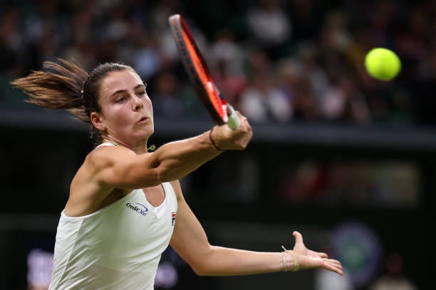 S Emma Navarro returns against US player Coco Gauff during their women's singles fourth round tennis match on the seventh day of the 2024 Wimbledon...