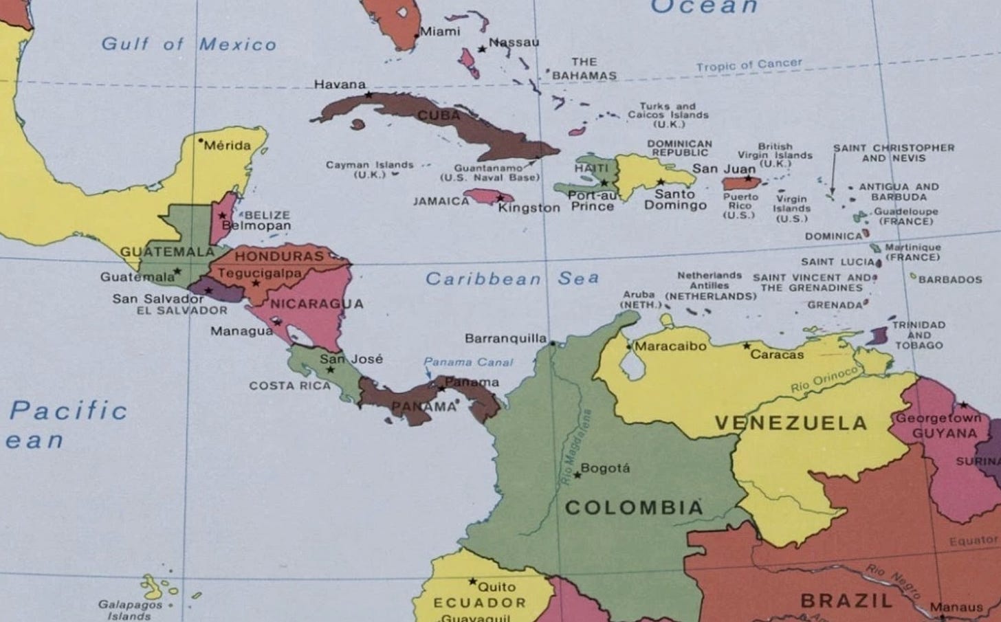 May be an image of map and text that says 'Gulf of Mexico Miami Nassau Havana eaл THE BAHAMAS *Mérida Tropic of Cancer Cayman Islands Islands Guantanamo (U. Naval Base) ABELIZE elmopan DOMINICAN HAITI JAMAICA British San Juan Port-aut Kingston Prince SAINT CHRISTOPHER AND NEVIS GUATEMALA HONDURAS Guatemala* Tegucigalpa San Salvador EL SALVADOR Managua Santo Domingo Puerto Virgin ANTIGUA AND NICARAGUA Caribbean Sea Guadeloupe (U.S.) (FRANCE) DOMINICA Netheriands San José Martinique SAINT LUCIAS (FRANCE) Aruba (NETHERLANDS) COSTA RICA Barranquilla Pacific ean SAINT GRENADINES GRENADA Panama Canal BARBADOS Maracaibo AMA TRINIDAD TOBAGO Caracas Orinoco Rio Bogotá VENEZUELA ಕ్ನ್ರ Galapagos Lelongos GUYANA COLOMBIA *Quito ECUADOR BRAZIL Manaus'