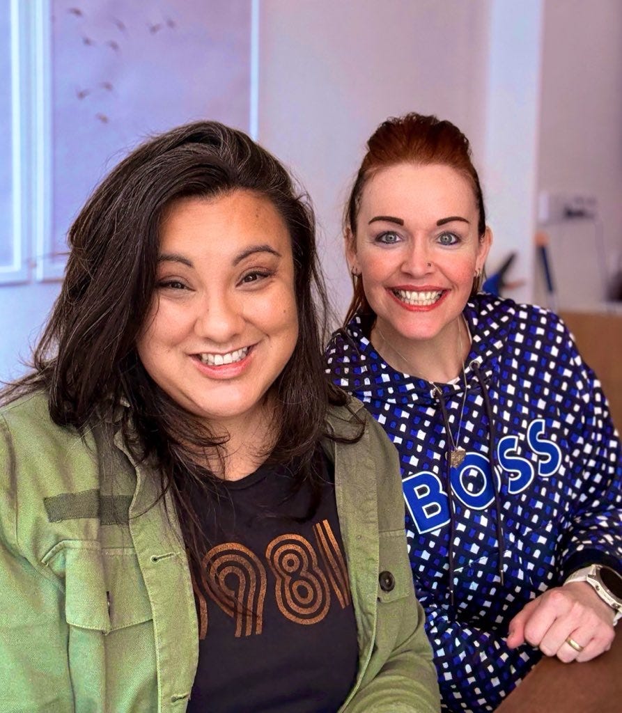 Georgina Dean smiling alongside Amy Beeson during their coffee meeting, planning creative collaborations for the Substack community.