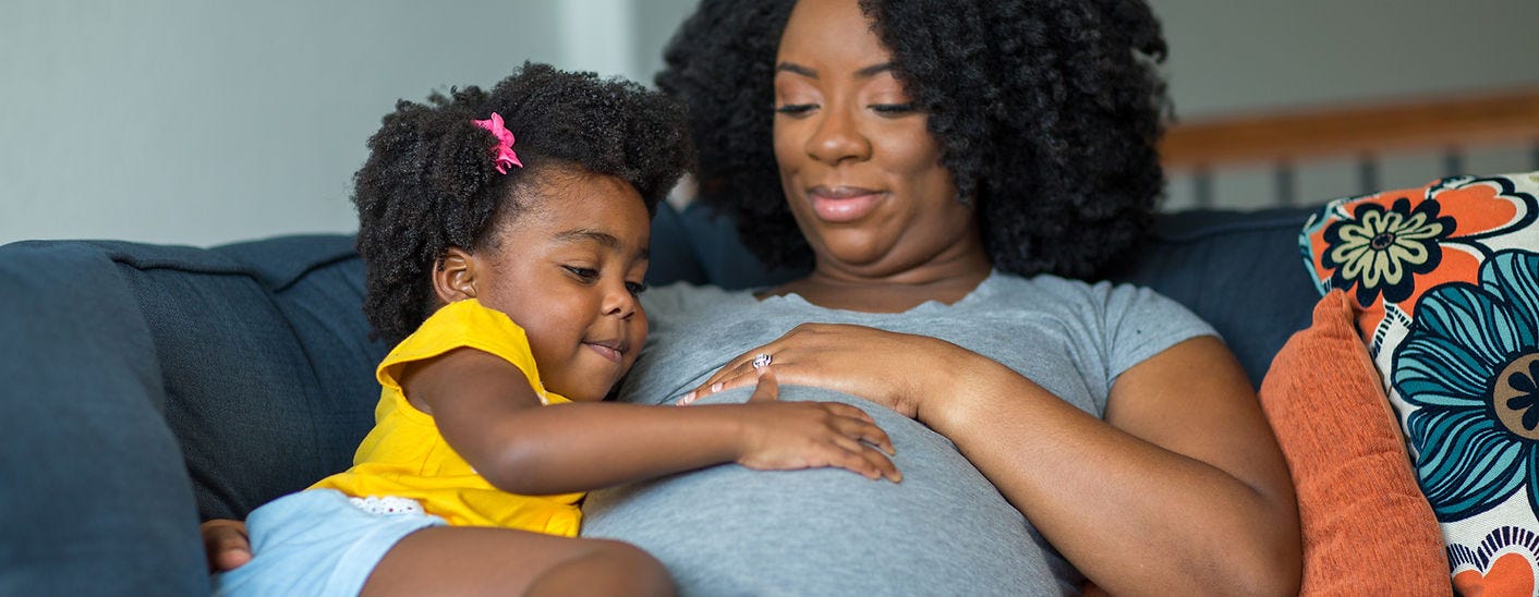Pregnant person and toddler