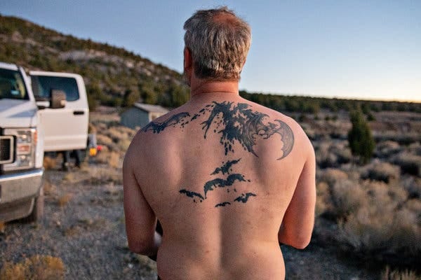 Mr. Silas displayed his bat-themed tattoos.