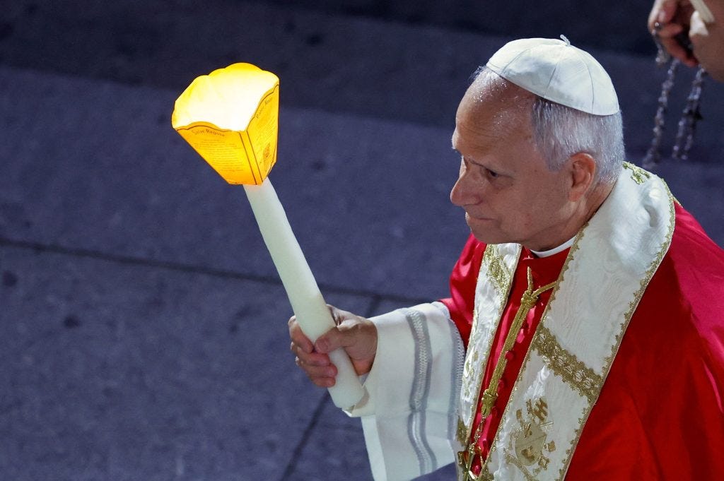 Pope Leo XIV holds a candle in the Lourdes torchlight procession Pope Leo XIV holds a candle in the Lourdes torchlight procession