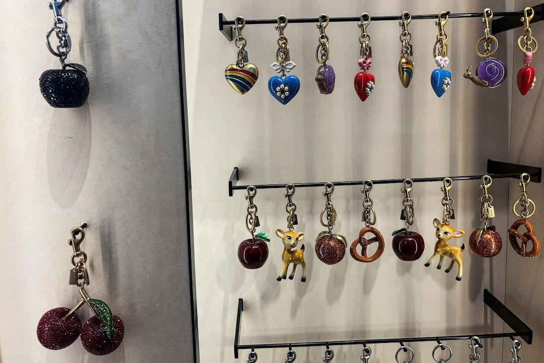Coach bag charms are displayed at their store on Fifth Avenue in New York City