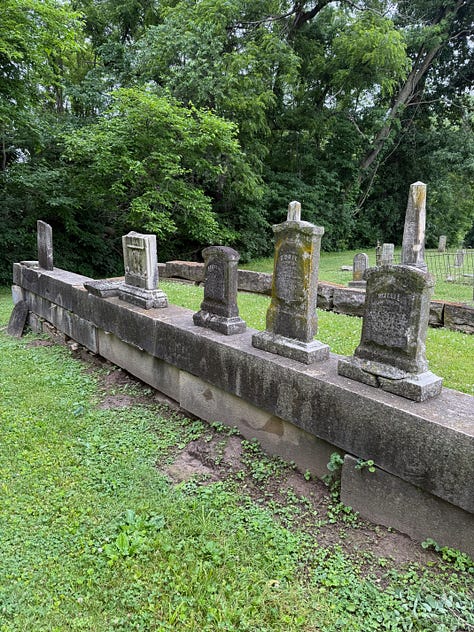 The first image is a fence finial, mossy and rusted down. The last is a lone grave stone as far into the corner as you can get. And I thought the middle shot of a family site was interesting. Those stones aren't going to sink!
