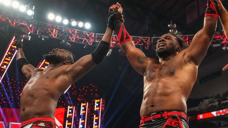 Kofi Kingston and Xavier Woods celebrating