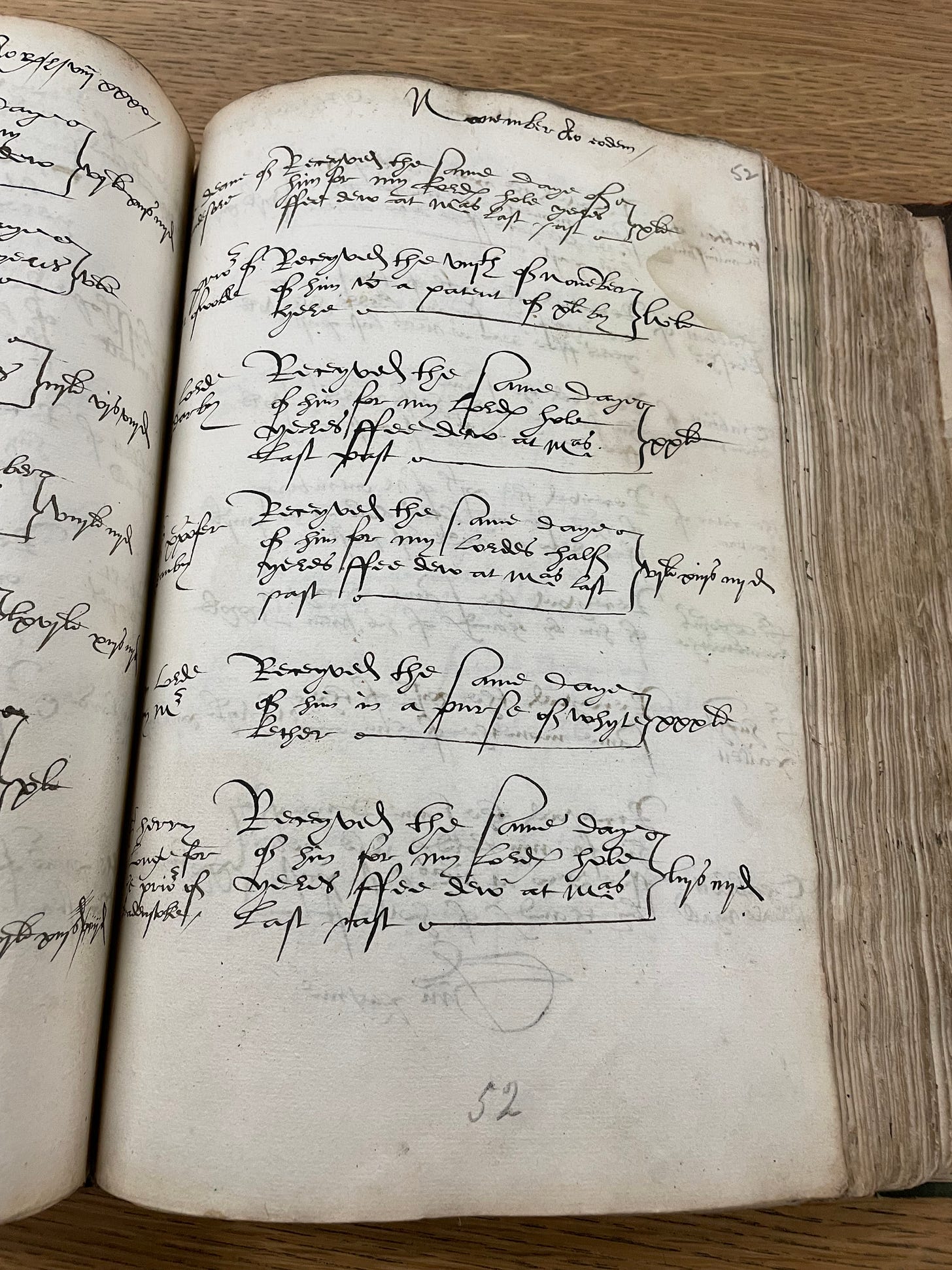 An open book containing entries in black ink, written in 16th century handwriting. The Paige is headed November.
