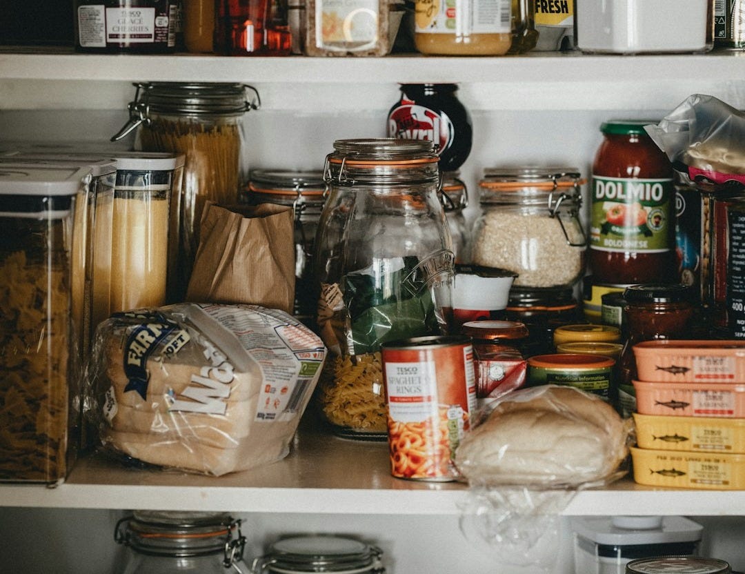 clear glass jars on white shelf