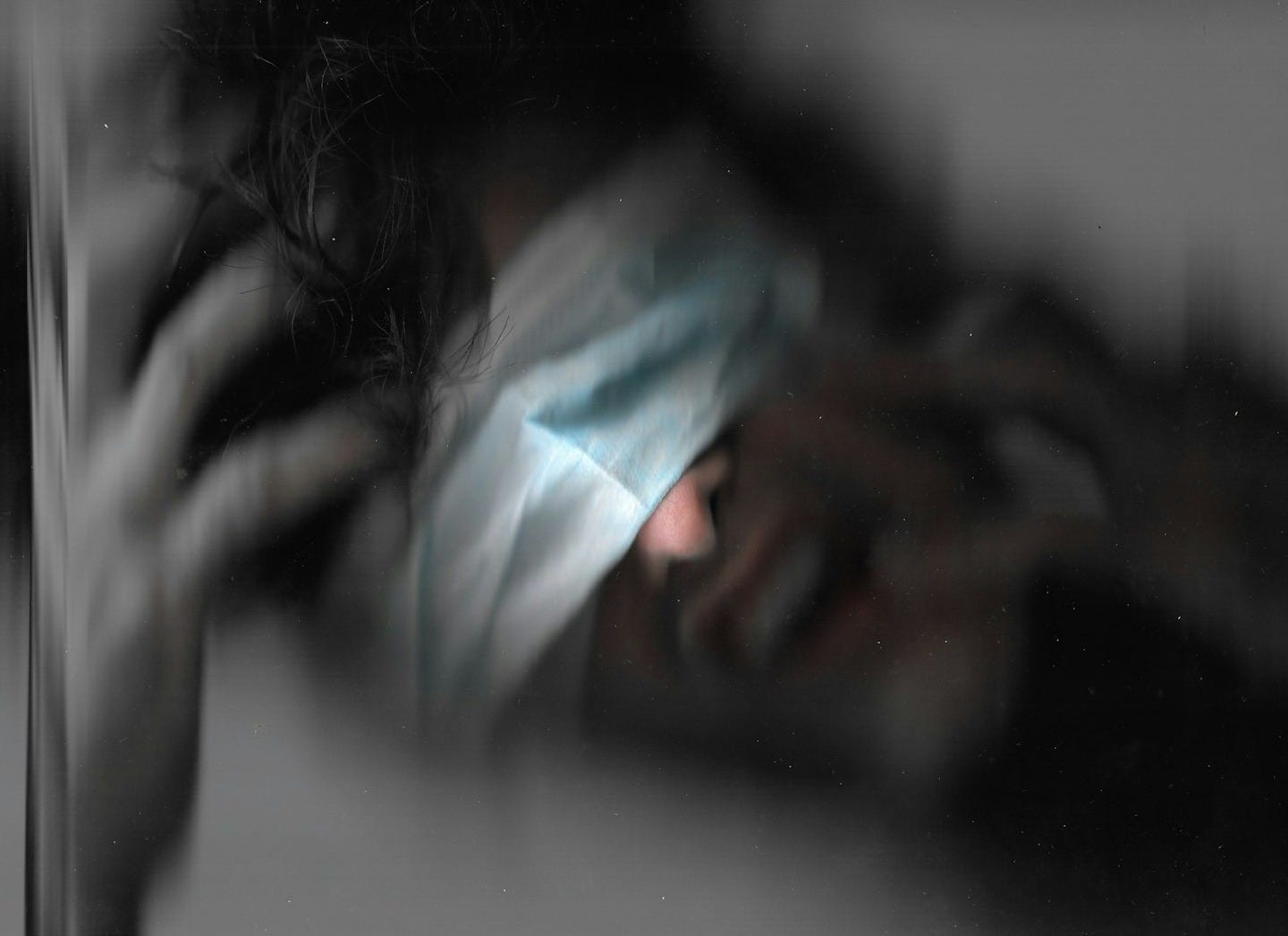 a blurry photo of a person with a blindfold