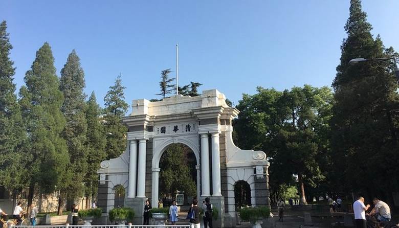 A white archway with columns and people walking around

AI-generated content may be incorrect.