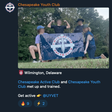 A screenshot from Telegram showing an image of four individuals posing with a flag that says “Chesapeake Youth Club,” with text indicating that Chesapeake Active Club and Chesapeake Youth Club met and trained together. A screenshot from Telegram showing an image of four individuals posing with a flag that says “Chesapeake Youth Club,” with text indicating that Chesapeake Active Club and Chesapeake Youth Club met and trained together.