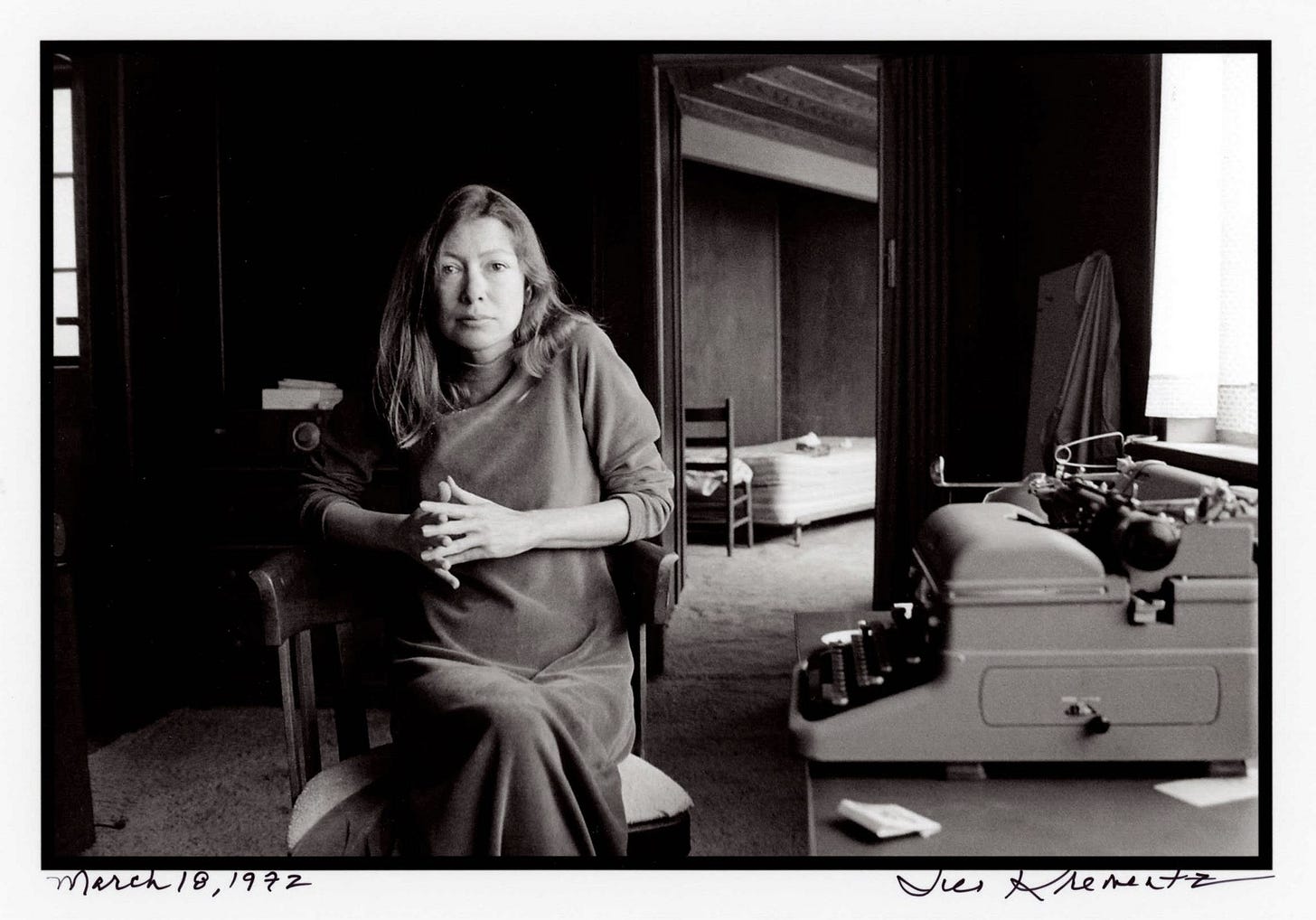 Joan Didion sits beside her typewriter. Joan Didion sits beside her typewriter.