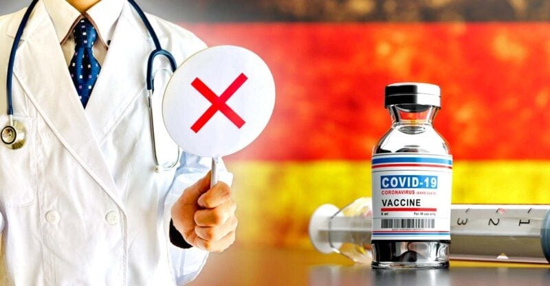 germany flag and covid vaccine with doctor holding up sign with "x" on it germany flag and covid vaccine with doctor holding up sign with "x" on it