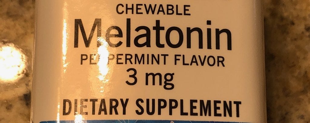 Yellow label of a melatonin supplement bottle describing 3mg chewable tablets with peppermint flavor Yellow label of a melatonin supplement bottle describing 3mg chewable tablets with peppermint flavor