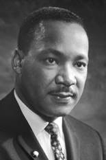 Black-and-white head shot of King wearing a suit and facing left Black-and-white head shot of King wearing a suit and facing left