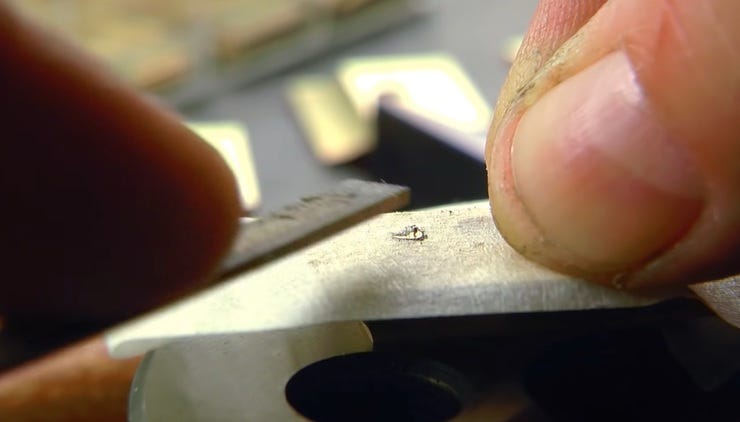 Protecting a work surface while filing rivets.