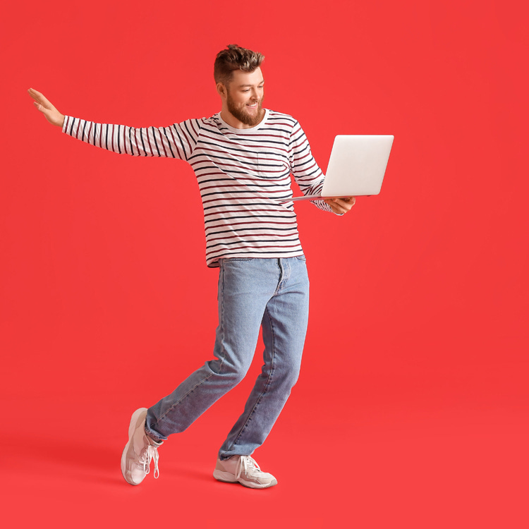 Writer dancing with laptop representing pantsing.