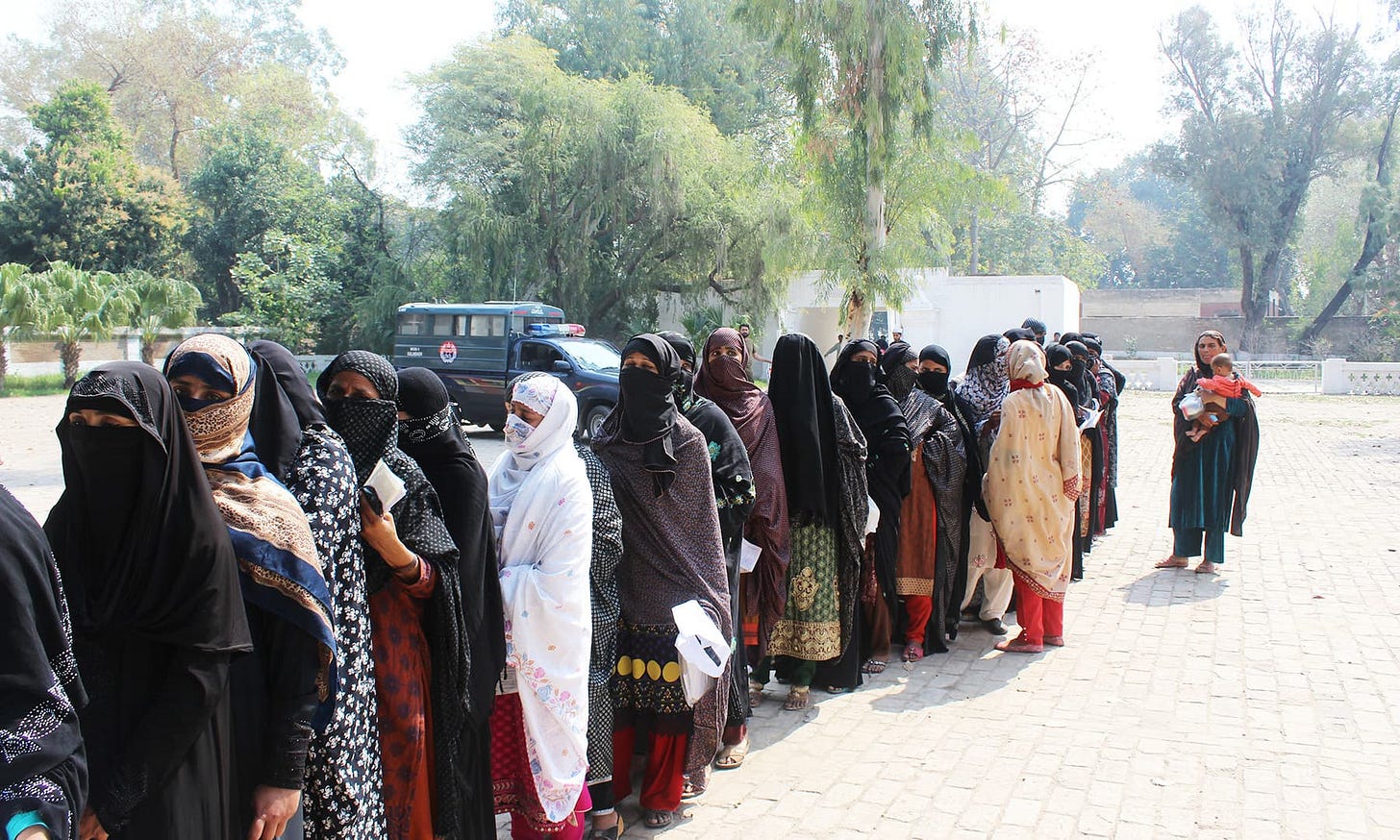 Women form queues to get a CNIC from Nadra's mobile registration van in Kalabagh. — Photo by author
